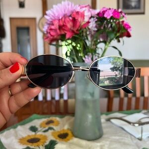 Gold and Black Oval Sunglasses
